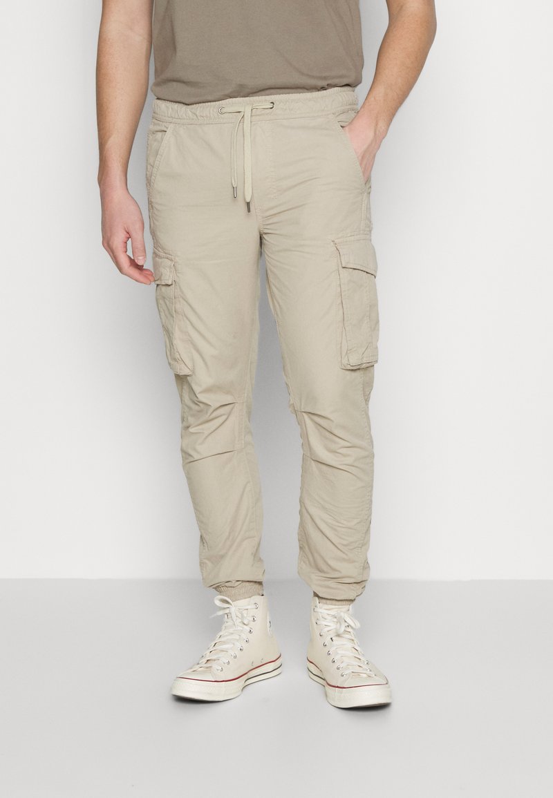 Schott EXPLORE Cargo trousers light beige/beige Zalando.co.uk
