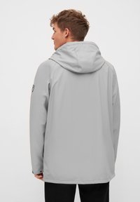 Light gray waterproof jacket with a hood, featuring a straight cut, adjustable cuffs, and a subtle sheen. No visible patterns or logos.
