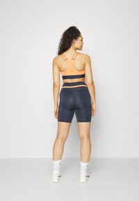 Puma RUN FIRST MILE BIKER - Leggings - parisian night