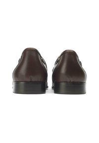 Brown leather dress shoes with a polished finish, rounded toe, and low black heel. Features smooth texture and subtle stitching detail.