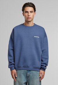 Another Cotton Lab BAD IDEAS GOOD STORYS OVERSIZE - Bluză de molton - blue