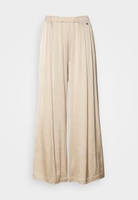 Beige wide-leg pants made of soft fabric, featuring an elastic waistband and a single decorative button detail on the side.