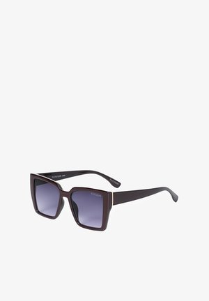 Lunettes de soleil carrées oversize de couleur marron foncé avec des verres dégradés violets et de fines accents dorés près des charnières.