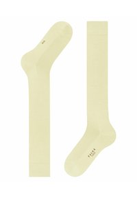 Helle gelbe Crew-Socken aus weichem Material mit einem gerippten Bündchen, nahtlosem Zehenbereich und dezentem Branding an der Sohle.