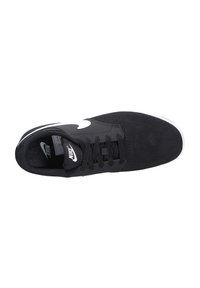 Black Nike sneaker with a suede and synthetic upper, white swoosh logo, black laces, and textured rubber sole. Top view.