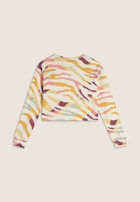 Sweatshirt cropped a maniche lunghe con un motivo ondulato multicolore in tonalità pastello di rosa, giallo, verde e viola scuro su uno sfondo crema.