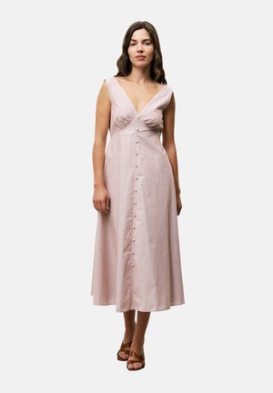 Maxi dress in light pink fabric with a deep V-neck, front buttons, and a fitted bodice. Features wide straps and a flared hem.