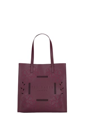 Donkerpaarse lederen tote tas met een bloemvormig uitgesneden ontwerp en "Ted Baker London" gedrukt aan de voorkant, voorzien van twee schouderbanden.