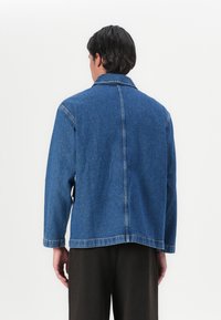 Marimekko POWERI UNISEX  - Giacca di jeans - worn indigo