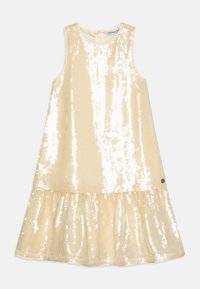 Robe sans manches en beige avec des détails en sequins, présentant un ourlet évasé et un col rond. Petit accent logo en bas.