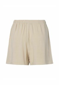Shorts amples beiges avec une taille élastique, fabriqués en tissu léger adapté à une tenue décontractée.