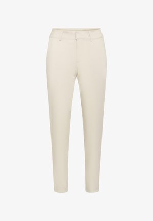 Béžové nohavice úzkeho strihu s pútkami na opasok, predným zipsom a strihom s dĺžkou nad členky.