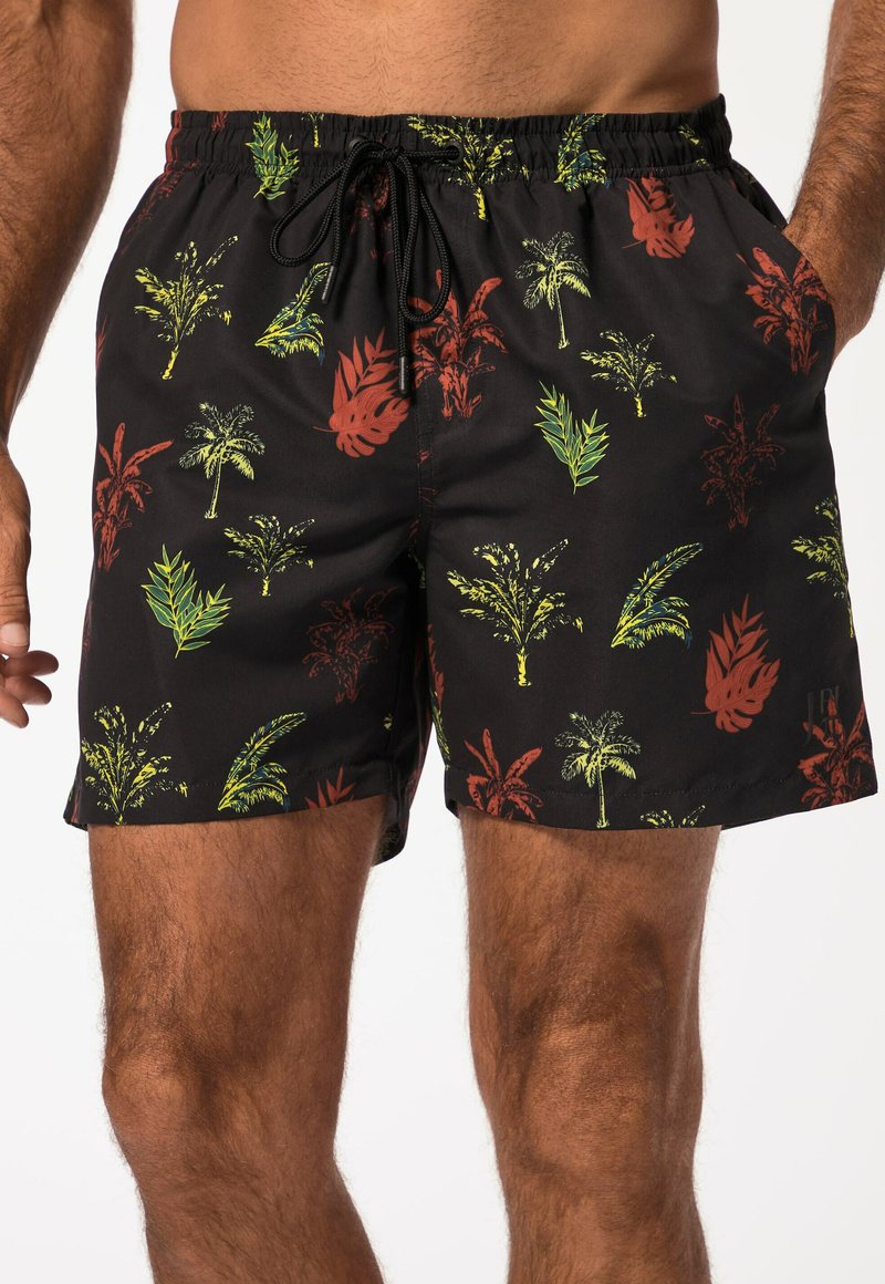 Shorts de bain noirs avec cordon de serrage, présentant un motif tropical vibrant de feuilles en vert et rouge. Fabriqués en matériau léger et à séchage rapide.