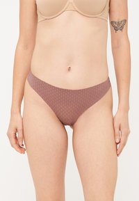 Hnedé vzorované bikinové nohavičky s nízkym strihom a hladkým materiálom. Elastický pás a minimalistický dizajn. Žiadne viditeľné kovania.