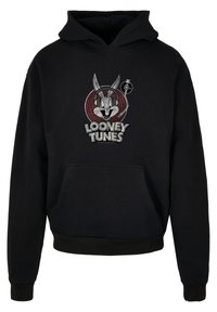 Svart hettegenser med Looney Tunes-design av Bugs Bunny, med et grafisk trykk i grått og rødt. Inkluderer en lomme foran.