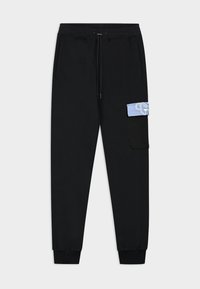 Zwarte joggers van zachte stof, met een elastische tailleband met trekkoord, zijzakken en een blauwe accentzak op het rechterbeen.