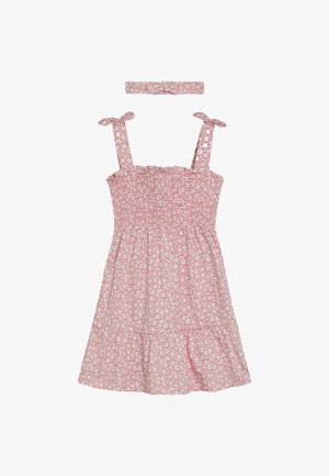 Roosa lillelise mustriga smock-kleit, millel on sidumisrihmad ja kihiline disain. Lisandub vastav peapael. Valmistatud kerge materjaliga.