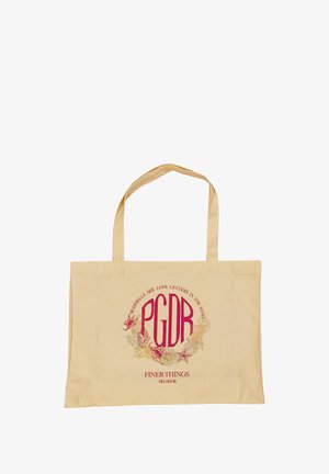 Beige canvas tote bag with red and gold text design. The text reads, "PGDR FINER THINGS," surrounded by marine-themed illustrations.