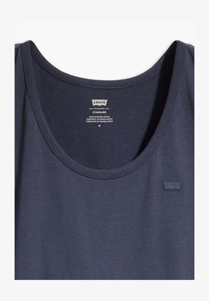 Granatowy bawełniany top bez rękawów z okrągłym dekoltem i małym wyszywanym logo po lewej stronie. Miękka struktura z minimalnym szyciem.