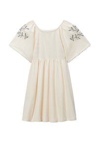 Robe couleur crème avec un tissu texturé, manches bouffantes courtes et broderie de feuilles noires sur les épaules. Design de jupe évasée.