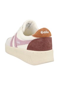 Gola sneakers featuring a white leather upper with pink and brown suede accents, round toe, and textured rubber sole.