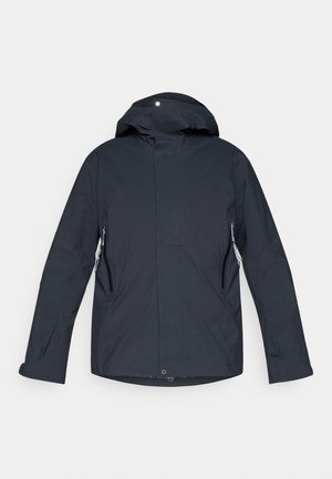 Marinblå, huvad jacka i lättviktsmaterial. Har dragkedjeförsedda sidofickor och rak skärning, med minimalistisk design.