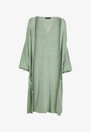 Cardigan en maille vert clair à coupe ample, avec des manches larges et des poches ; tissu texturé avec un décolleté en V.