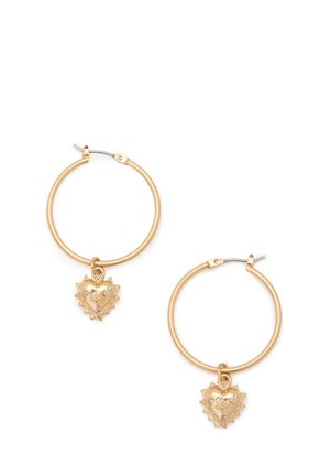 Gold-toned hoop earrings featuring a heart-shaped charm with spikes and small rhinestones. The hoops are round and smooth in texture.