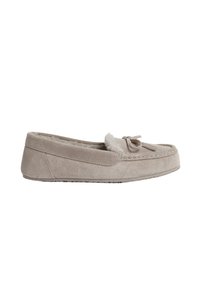 Pantofola in suede di un beige chiaro con fodera morbida, dotata di un fiocco decorativo sulla parte frontale, suola piatta e dettagli di cucitura lungo i bordi.