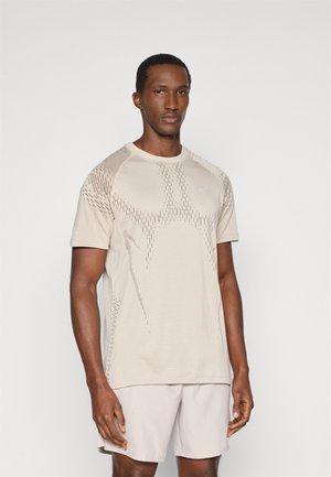 STRIDE TOP - Sport T-Shirt - cream/mink brown/reflective silver-coloured
