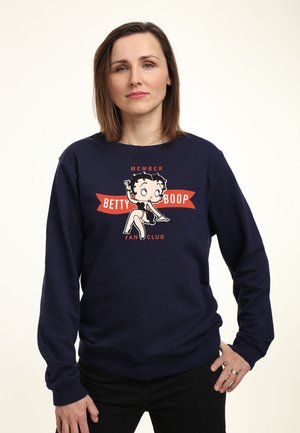 Dunkelblaues Sweatshirt mit Betty Boop Grafik, versehen mit den Aufschriften "MEMBER" und "FAN CLUB" in Rot. Hergestellt aus weichem Material, mit gerippten Bündchen und Saum.