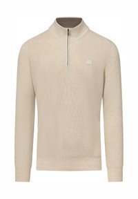 Beige gebreide trui met een halve ritskraag, ribbelige textuur en aansluitende manchetten. Subtiele logodetail bij de kraag.