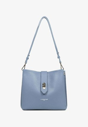 Light blue leather handbag with a structured shape, featuring a central flap and metal hardware. Adjustable shoulder strap included.