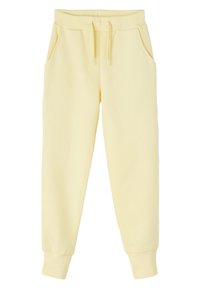 Pantalones de chándal amarillos de algodón con cintura elástica, cordón y bolsillos laterales. Piernas ajustadas con puños acanalados en el tobillo.