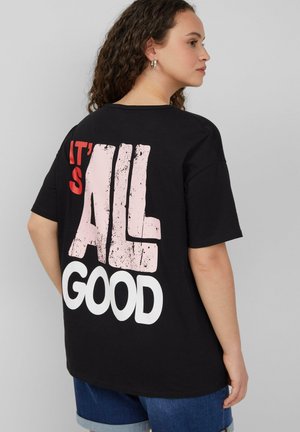 Schwarzes Baumwoll-T-Shirt mit übergroßem Text auf der Rückseite: "IT'S ALL GOOD" in Weiß und Pink, mit lockerer Passform und kurzen Ärmeln.