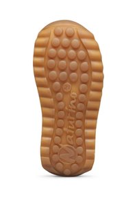 Suola di scarpa in gomma di un marrone chiaro con un pattern di grip circolare testurizzato, bordi scanalati e nome del marchio "Naturino" in posizione centrale.