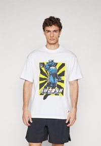 White cotton t-shirt featuring a colorful graphic design with a blue character and "SWOOSH" text on a yellow and black radial background.
