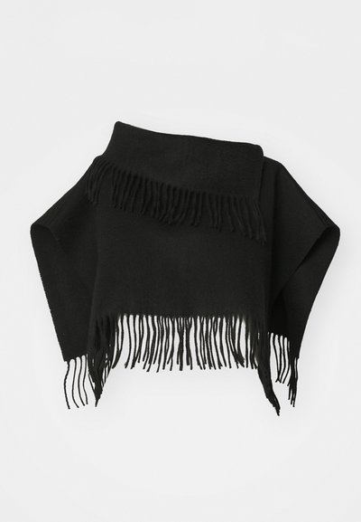 Black fringed shawl made of soft fabric. Features uneven edges and long, thin fringes at the bottom. Versatile for layering.