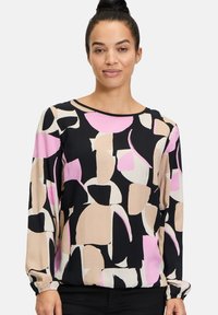 Bunt gemusterte Bluse mit abstrakten Formen in Pink, Beige und Schwarz; verfügt über lange Ärmel mit elastischen Bündchen und einem runden Ausschnitt.