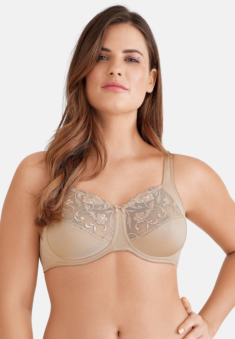 Beige beha met een bloemenkant overlay bovenaan, zachte cups, onderbedekking en brede verstelbare banden. Strak en naadloos ontwerp.