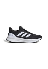 Chaussure de running noire avec semelle blanche et trois bandes blanches sur le côté, vue de l'extérieur.