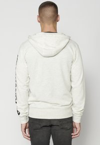 Koroshi Sudadera con cremallera - crudo