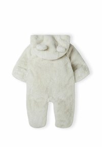 Mono de baby polar en blanco roto con capucha que incluye orejitas suaves. El diseño cuenta con mangas largas, piernas completas y sin cierres.