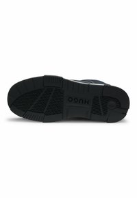 Black sneaker sole with textured rubber grip patterns and a prominent brand logo. Features a sturdy design and contrasting accents.