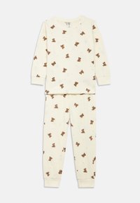 Completo pigiama in cotone color crema con maniche lunghe e polsini elasticizzati, caratterizzato da un motivo con orsetti sparsi tra piccole stelle.