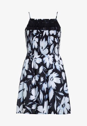 Blumenkleid in Schwarz und Weiß mit blauen Akzenten, das über ein gesticktes Oberteil, dünne Träger und einen bis zum Knie ausgestellten Rock verfügt.