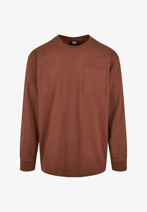 Pikema, kantavate värvitoonidega puuvillane T-särk pikkade varrukatega, ümmarguse kaelusega ja rindade taskuga. Sujuv tekstuur, mugav lõige ja lihtne disain.