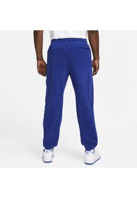 Nike Sportswear AIR WINTER PANT - Cargo trousers - deep royal blue/white