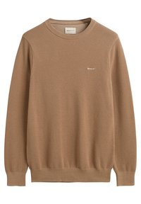 Pull en tricot marron avec un motif texturé, col rond et poignets côtelés. Logo discret sur la poitrine. Fabriqué en matière douce.