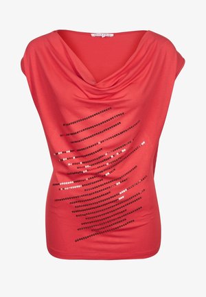 Rood coltrui gemaakt van zachte stof, met zwarte paillettenstrepen die diagonaal over de voorkant lopen. Korte mouwen.